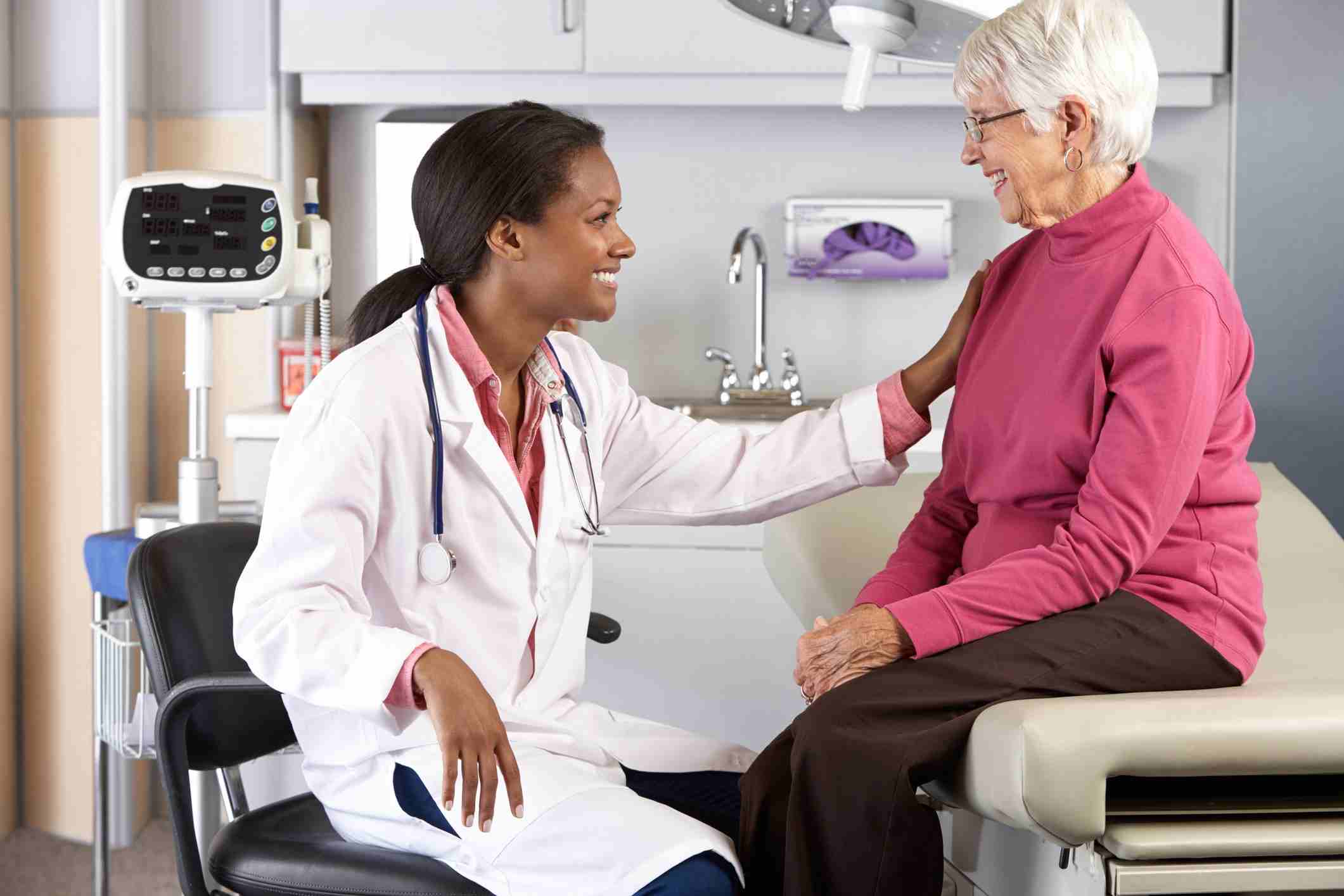A woman discusses her health with a doctor in a medical office in Shreveport, LA