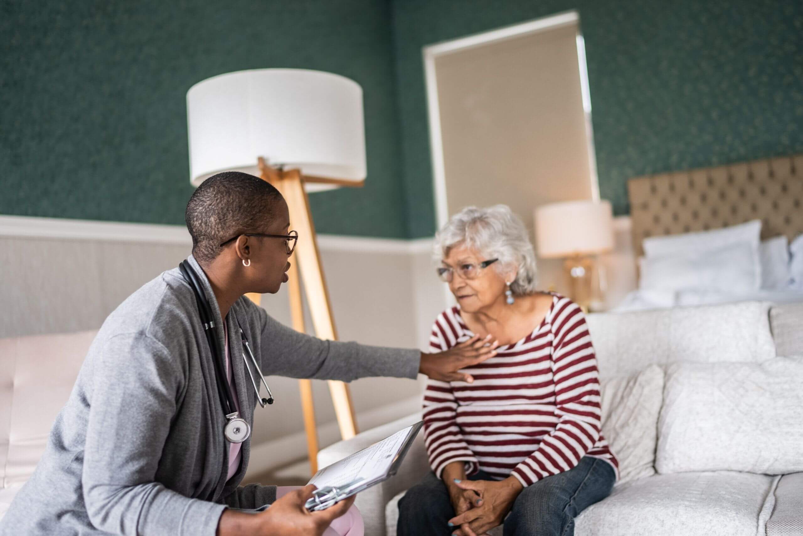 Doctor discusses Cardiac & Respiratory Rehabilitation with an elderly woman in Shreveport, LA