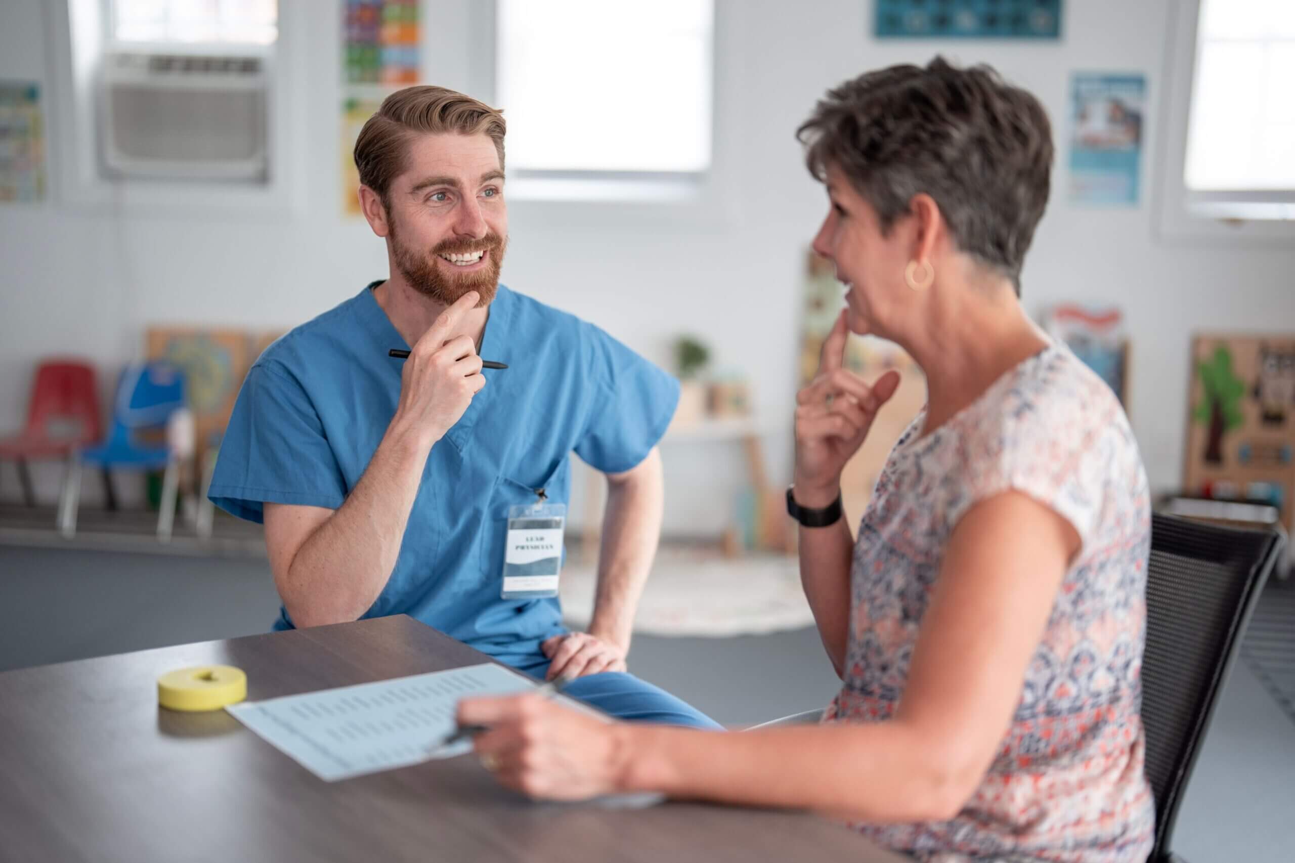 Male nurse discussing speech therapy with a patient in Shreveport, LA